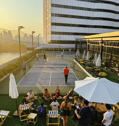 Padel court and indoor volleyball facilities at a hotel near Queen Sirikit National Convention Center